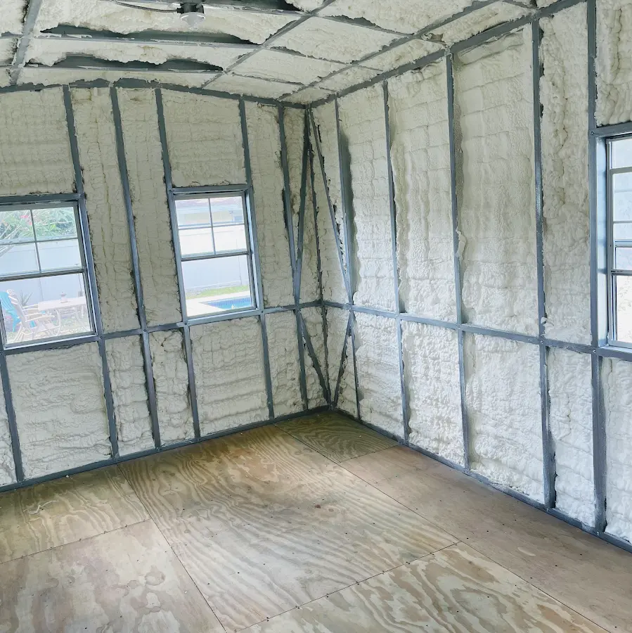 Closed-cell spray foam insulation applied to wall cavities in a residential project in East Niles